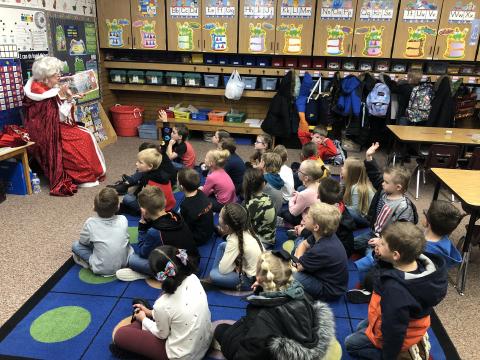 Mrs Claus reading to students